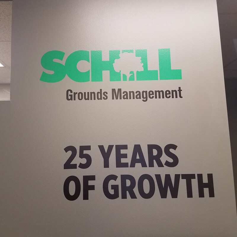 Mixed media history wall for Schill Grounds Management 25 year anniversary